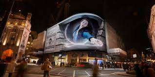 Spectacular 3D anamorphic screen displaying a car breaking out of a digital billboard in a city center.