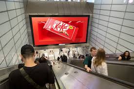 Creative team designing a 3D anamorphic billboard with depth illusion and realistic lighting for outdoor advertising.